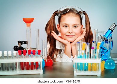 Little girl is making science experiments. Education. - Powered by Shutterstock