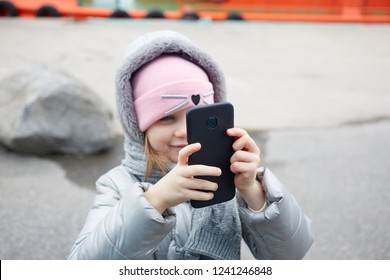 Little Girl Making Video Or Photo With Mobile Phone.