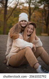 Little Girl With Mather In Autumn Park 