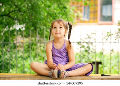 Little girl meditating outdoors. Relaxation and recreation. - Powered by Shutterstock