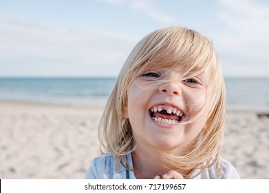 Little Girl With Missing Front Tooth Smiling 