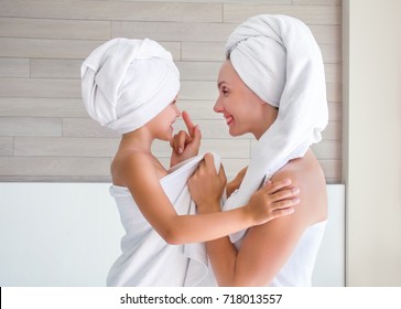 Little Girl With Mom In Towel In Bathroom