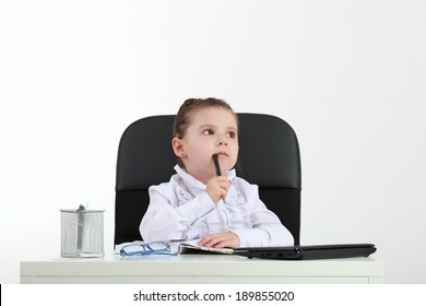 Little Girl In The Office Computer. Isolated On White Background