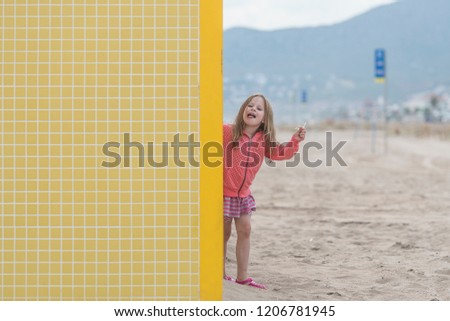 Little girl on the beach. Mediterranean holiday