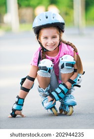 Little girl on roller skates at park