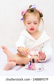 Little Girl Painting Nails While Wearing Hair-rollers, At Home