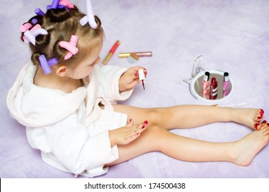 Little Girl Painting Nails While Wearing Hair-rollers, At Home