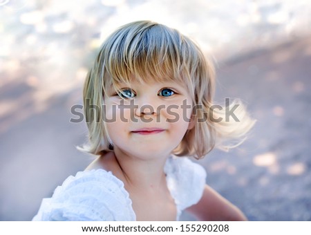 Similar – Small child with long blond hair enjoying of a sunny day