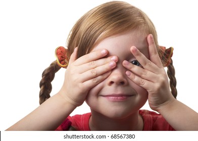 Little girl peeping through hand with one eye isolated over white background