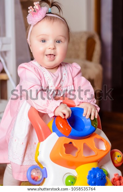 Little Girl Pink Dress Playing Toy Stock Photo Edit Now 1058535764