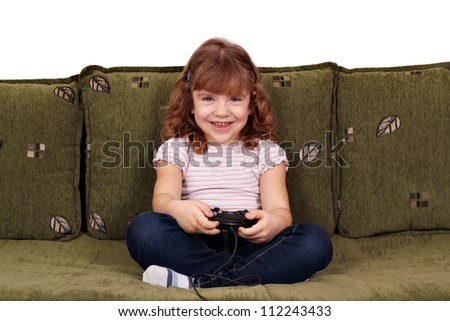 Similar – happy child playing video games with gamepad at home