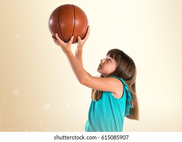 Little Girl Playing Basketball