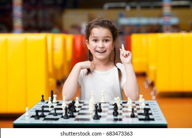 Little Girl Playing Chess