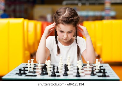 Little Girl Playing Chess