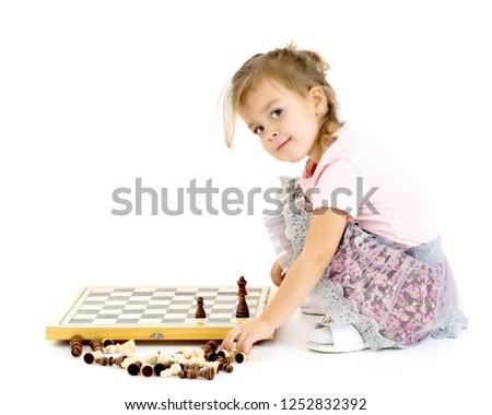 Image, Stock Photo lifestyle shot of smart kid girl playing checkers at home