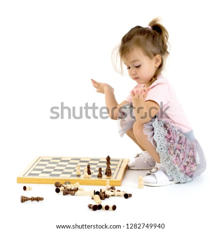 Similar – Image, Stock Photo lifestyle shot of smart kid girl playing checkers at home