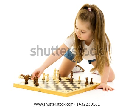 Similar – lifestyle shot of smart kid girl playing checkers at home