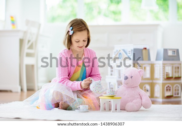 kids playing with dolls