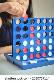 Little Girl Playing Four In A Row, 4 In Line Game, Game Education Toys For Kids.