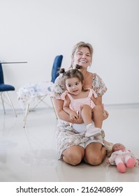 Little Girl Is Playing With A Granny. Cute Baby With Mother. Happy Kid. 