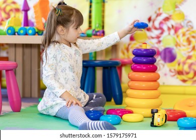 little girl playing in kindergarten or at home in the nursery - Shutterstock ID 1579175971