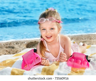 Little Girl  Playing On  Beach.