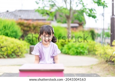 A little girl playing in the park
