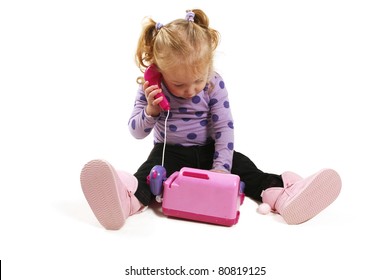 Little Girl Playing With Pink Toy Phone