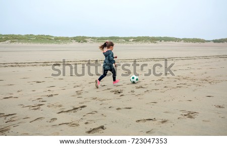 Similar – Image, Stock Photo Three generations female playing soccer on the beach