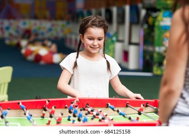 Little Girl Playing Table Football