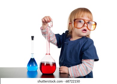 little girl playing with test tubes