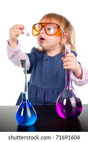 little girl playing with test tubes