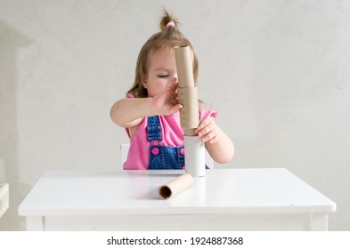 Little Girl Playing With Toilet Paper Rolls And Cardboard Tube. Games And Toys Made Paper Tube For Babies And Toddler, Activities Montessori In Our Home, Child Development And Occupational Therapy