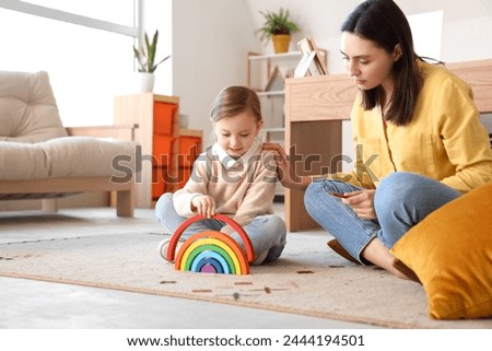 Similar – Image, Stock Photo Little girl playing with waves in the sea. Kid playfully splashing with waves. Child jumping in sea waves. Summer vacation on the beach