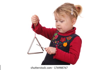 Little Girl Playing A Triangle Instrument On White Background 