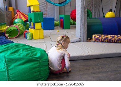 Little Girl Plays In A Sensory Integration Room On Floor