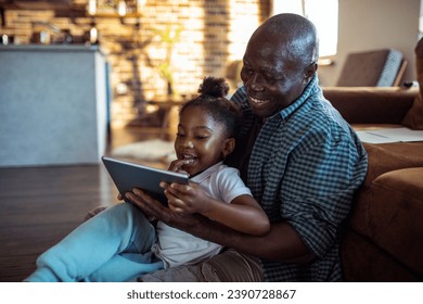 Little girl playtime with grandfather at home - Powered by Shutterstock