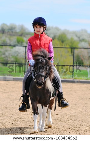 Little girl and pony