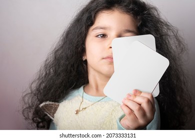 Little Girl Portrait Holding Two Flash Card In Hand, Preschool Learning Material. Flash Cards Selection Path Included.