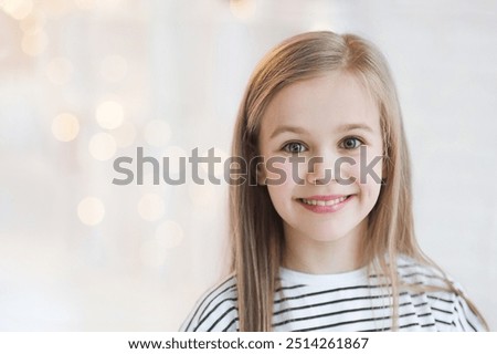 Similar – Image, Stock Photo Beautiful little girl, cute toddler with sunglasses is drinking orange juice and shows thumb up. Kid in in swimwear having fun during family vacation in a resort near pool. summer holidays