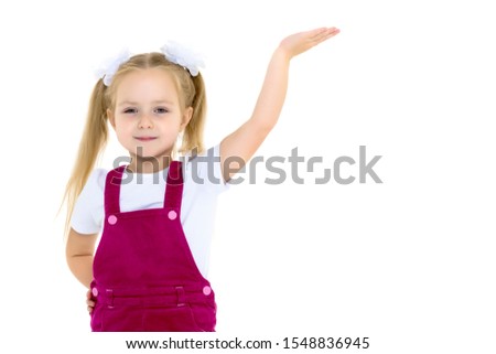 Little girl posing in studio on a white background.