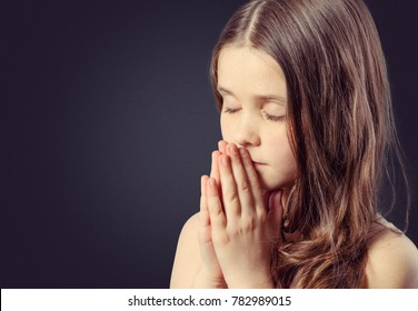 Little Girl Praying On Dark Background Stock Photo 782989015 | Shutterstock