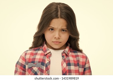 Little girl raise eyebrow isolated on white. Confident child with long brunette hair. Are you serious. Stop kidding me. Glance full of suspect. Kid looks offended and frowning. Stop bullying concept.