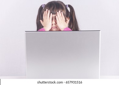 Little Girl Reacts While Using A Laptop. Internet Safety And Parental Control Concept