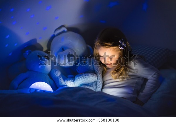 Little Girl Reading Book Bed Dark Stock Photo Edit Now