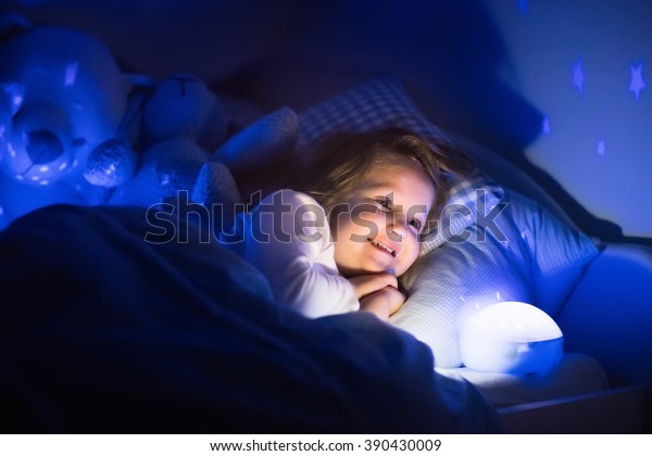 Little Girl Reading Book Bed Dark Stock Photo Edit Now 390430009