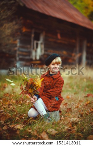 Similar – Foto Bild fröhlich lustiges Kind Mädchen isst frischen Apfel im Herbst