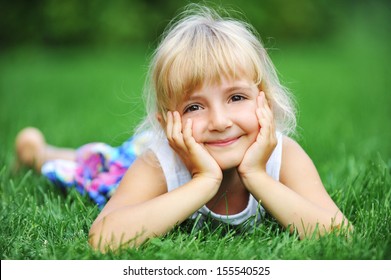 Little Girl Relaxing On Green Grass Stock Photo 155540525 | Shutterstock