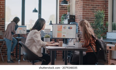 Little Girl Returning Back From School To Mother Workplace, Staying At Parent Work. Single Mom Working On Business Project On Computer While Daughter Arriving At Company Office. Working Mother