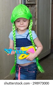 Little Girl Rock Star In Wig Play Guitar